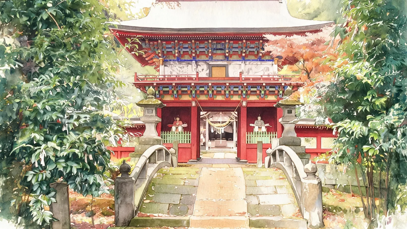 緑と紅葉に囲まれた朱色の門と、石の反り橋